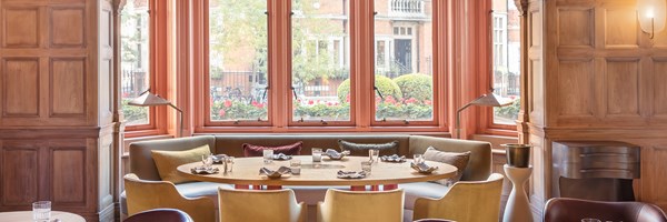 Hélène Darroze at The Connaught - room with round dining table next to the window.